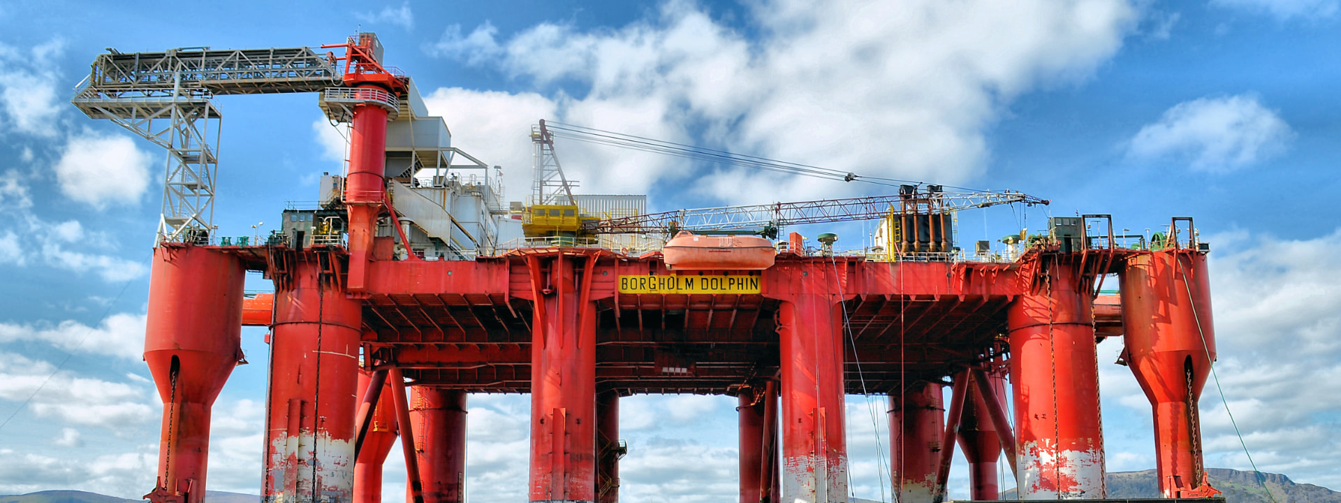 Offshore oil rig under a blue sky